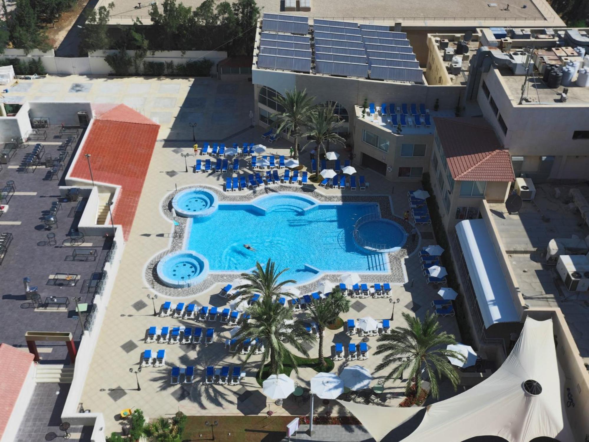Crowne Plaza Amman By Ihg Hotel Exterior photo Aerial view of the pool at the Hard Rock Hotel